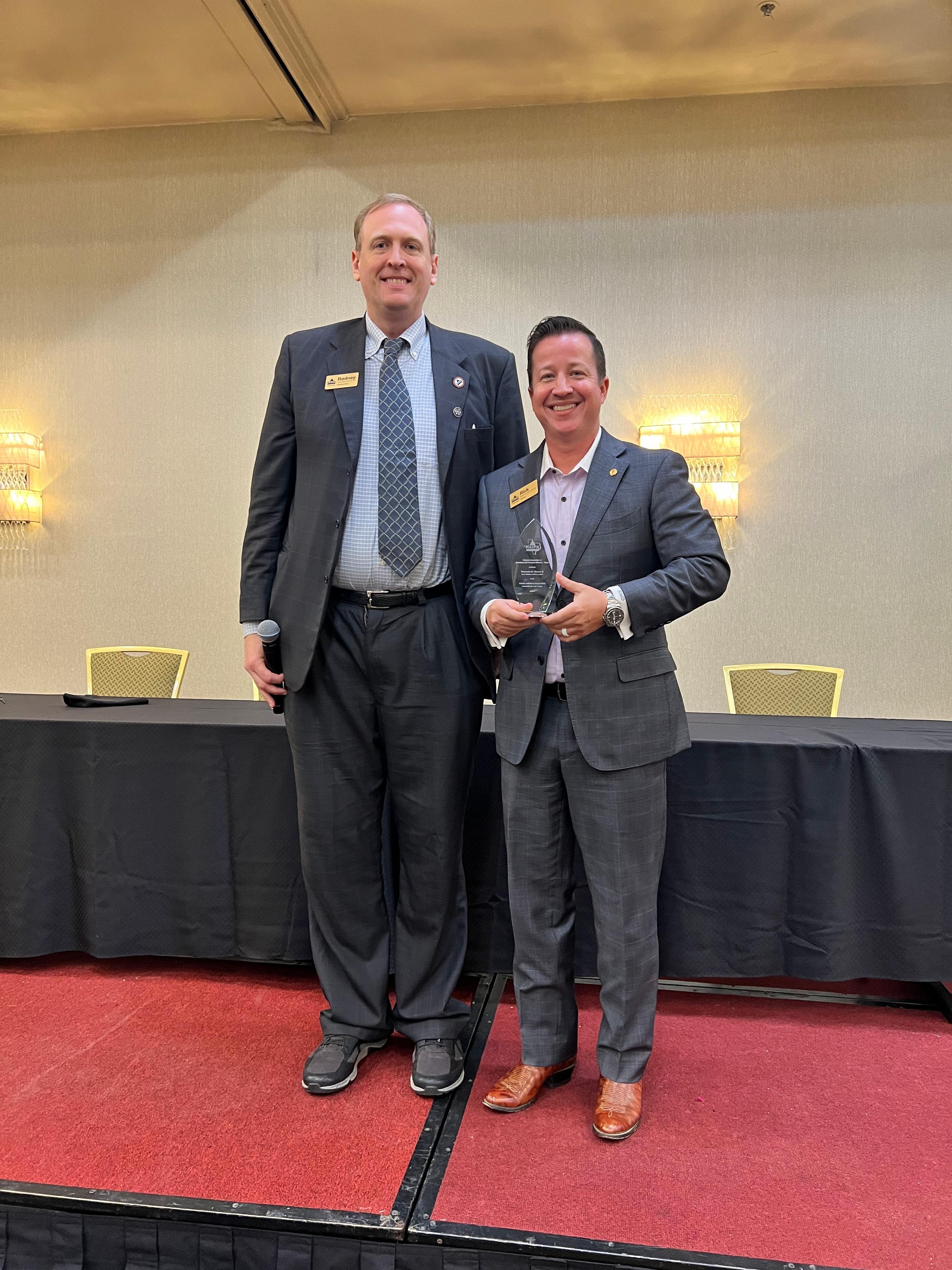 NAIFA-Texas President Elect Rodney Mogen awards Rick Demko with the YAT Leader of the Year Award